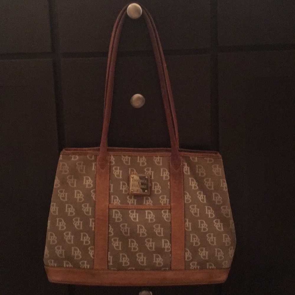 Dooney & Burke. Well loved. shows wear and tear.